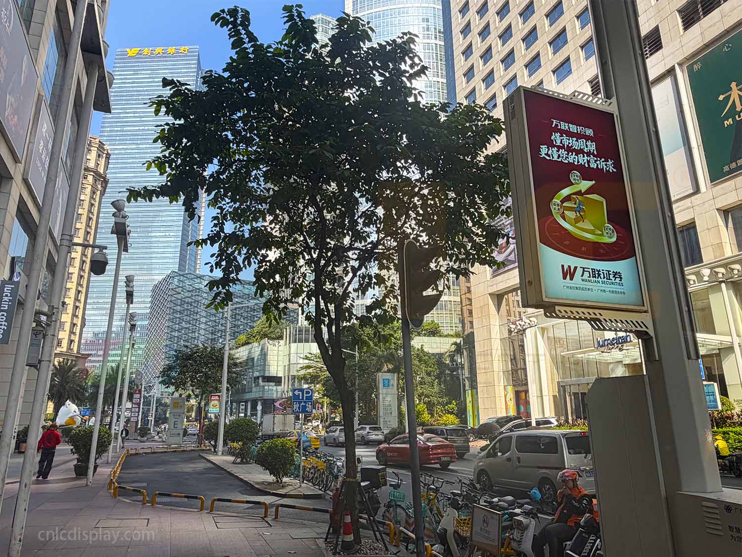 Pole-mounted outdoor LCD display on street light poles in Guangzhou, urban installation, stable operation for over three years