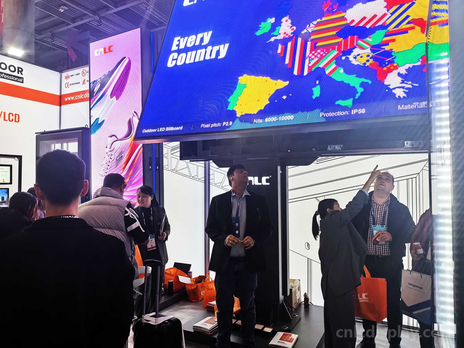 CNLC staff consulting with a client about outdoor LED Billboard solutions at ISE 2026.